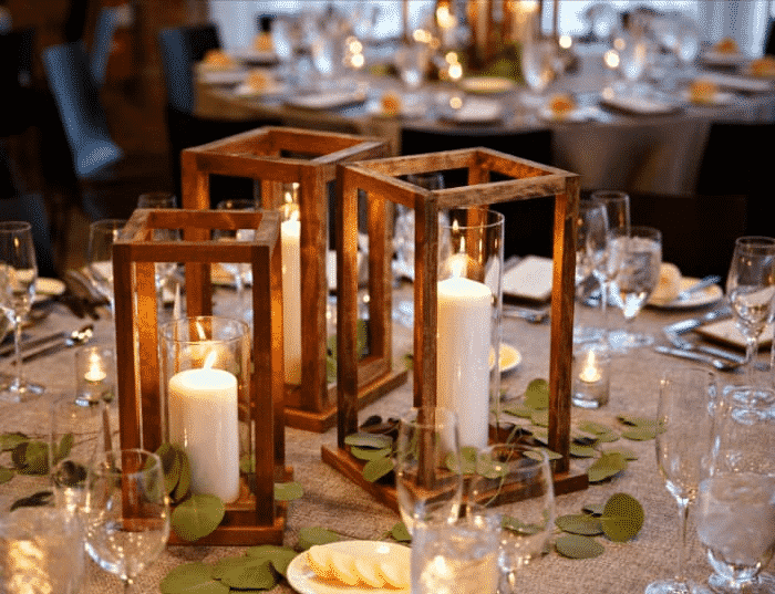 Candles and leaves on a table.