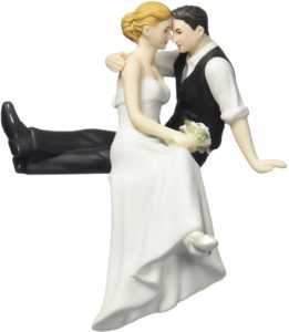 Bride and groom seated cake topper