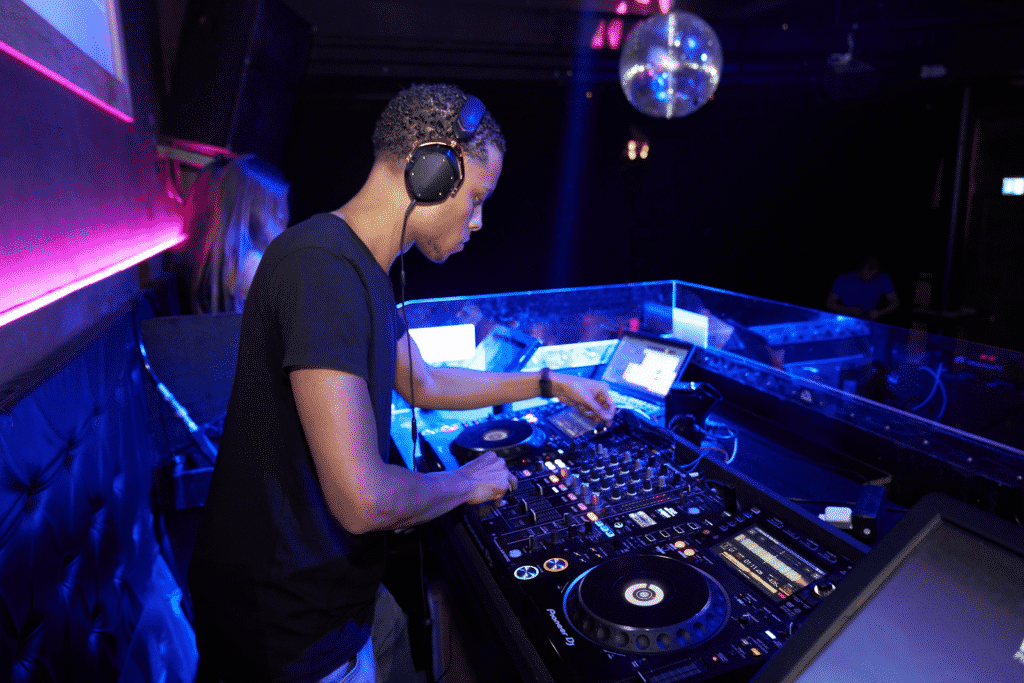 DJ using music equipment.