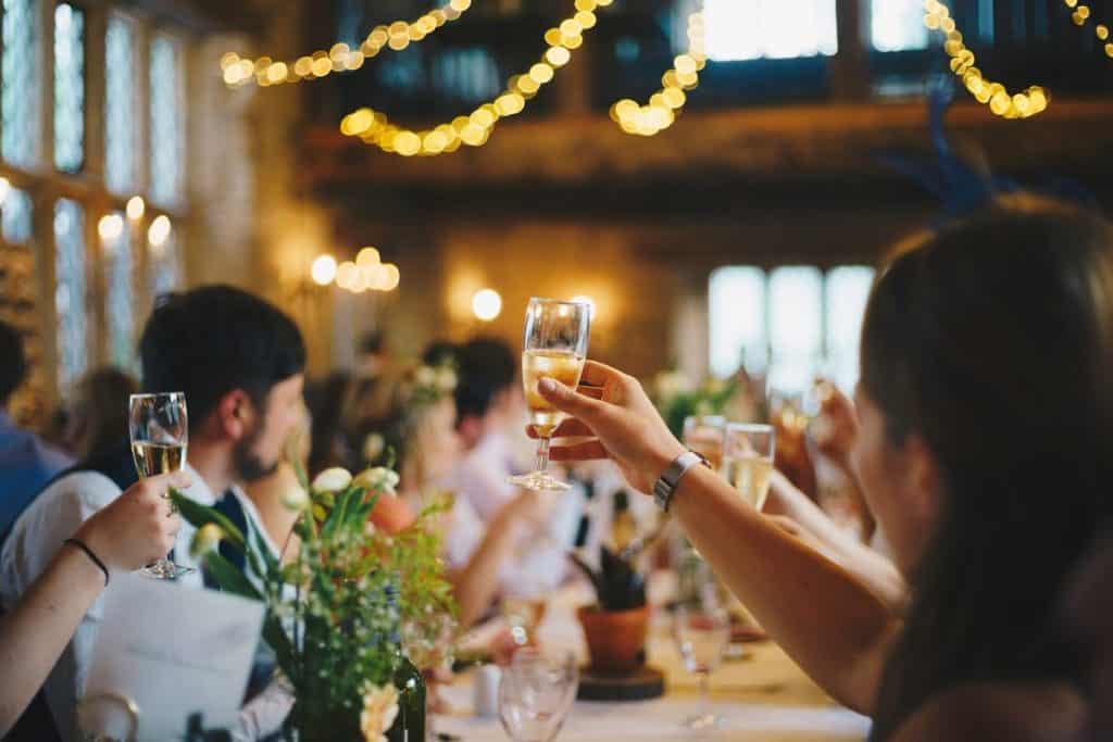 People raising glasses at an event